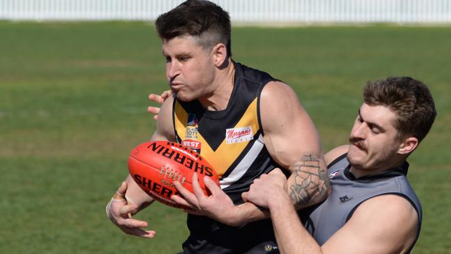 Brighton’s Will Rivers marks ahead of Port District defender Samuel McKay at Brighton Oval on Saturday. Picture: Brenton Edwards