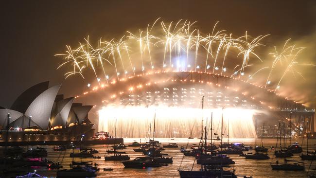 Fireworks explode over the Sydney Harbour Bridge and the Sydney Opera House as the clock strikes midnight on January 1, 2020. Picture: Getty Images