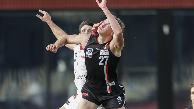 Mitch McCarthy goes up in the ruck for Frankston. Picture: Valeriu Campan