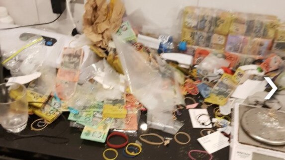 Neil Leslie Freemantle was arrested after police seized more than $1.5m cash and more than 40kg of various drugs from his New Farm residence.