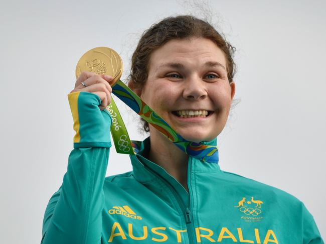 How sweet it is. Catherine Skinner celebrates on the podium after winning gold in the trap event.