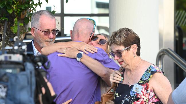 Family and friends console each other after the sentencing of a 14-year-old boy responsible for the deaths of their loved ones. Picture: NewsWire / John Gass