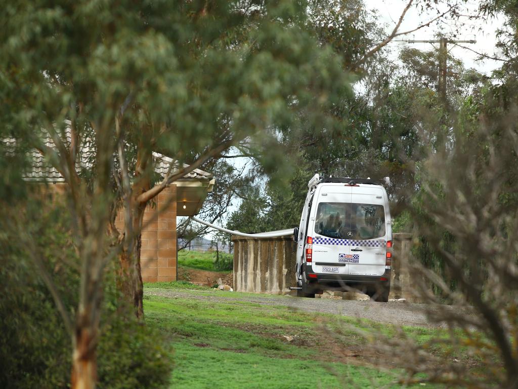 Police return to the scene of the triple murder at Hillier the day after three bodies were found. Picture: Tait Schmaal