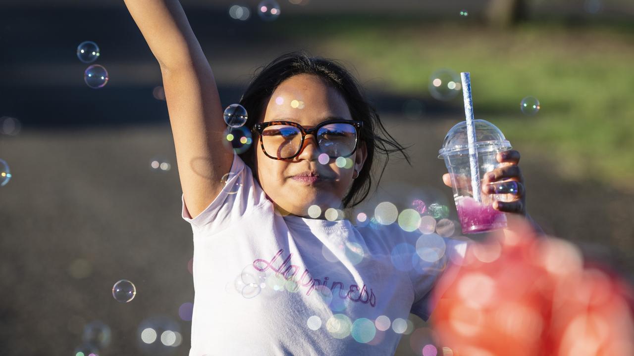 Chlouie Lavers plays with bubbles at Toowoomba Royal Show, Thursday, March 30, 2023. Picture: Kevin Farmer