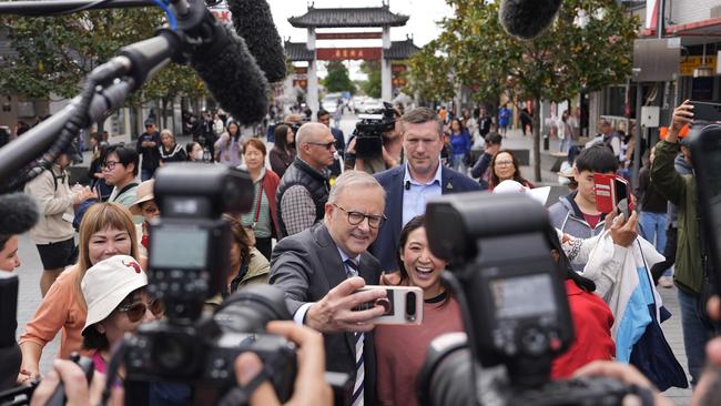 SYDNEY, AUSTRALIA - APRIL 28: Australian Prime Minister Anthony Albanese takes photographs with members of the public during a visit to Freedom Plaza in the suburb of Cabramatta in the electorate of Fowler on April 28, 2025 in Sydney, Australia. Albanese hit the campaign trail again for the final week leading into the election on Monday, after he was declared the narrow winner of the final leaders' debate, securing the support of 50 percent of the studio's undecided voters, compared to Peter Dutton's 25 percent, while the remainder stayed undecided. Albanese's performance was marked by a positive closing message focused on optimism and investment in Australia's future, though he faced criticism for stumbling over a key question on cost-of-living relief. (Photo by Asanka Ratnayake/Getty Images)
