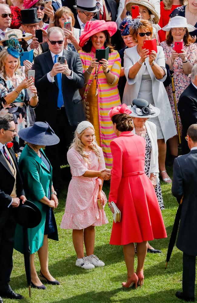 Britain's Catherine, Duchess of Cambridge (centre right) greets guests at a Royal Garden Party at Buckingham Palace. Photo: AFP