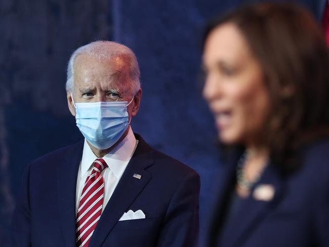 Joe Biden looks on as Vice President-elect Kamala Harris delivers remarks about the US economy. Picture: AFP