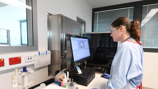 A Medical Scientist with SA pathology, working with a deactivated specimen of coronavirus preparing the sample for testing. Picture: Tricia Watkinson