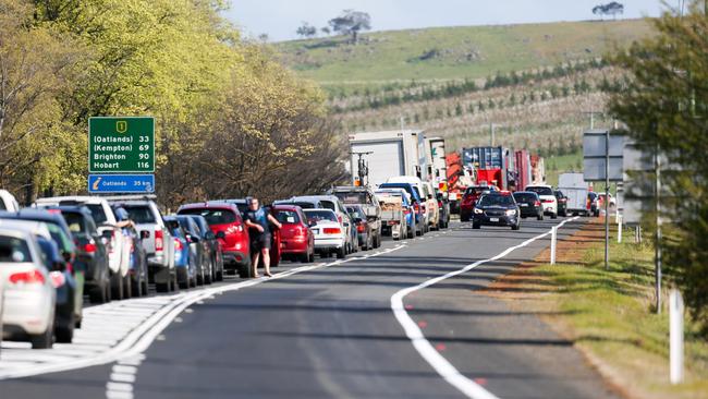 Traffic backed up on the Midland Highway near Ross after a fatal car crash involving multiple cars and victims.