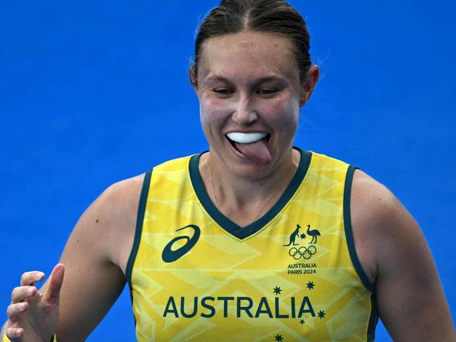 Australia's midfielder #21 Renee Taylor celebrates scoring her team's first goal in the women's pool B field hockey match between Australia and the USA during the Paris 2024 Olympic Games at the Yves-du-Manoir Stadium in Colombes on July 31, 2024. (Photo by Mauro PIMENTEL / AFP)