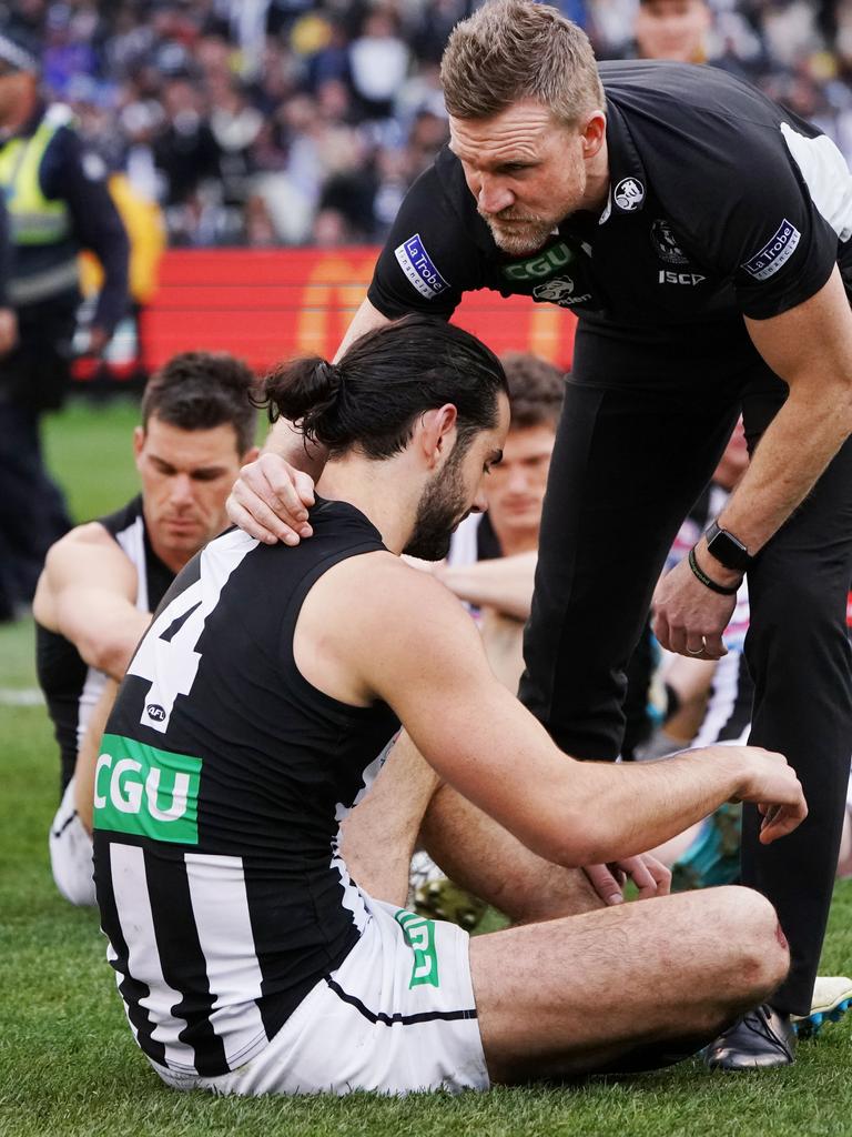 MELBOURNE, VICTORIA - SEPTEMBER 29: Magpies head coach Nathan Buckley hugs Brodie Grundy of the Magpies after their defeat during the 2018 AFL Grand Final match between the Collingwood Magpies and the West Coast Eagles at Melbourne Cricket Ground on September 29, 2018 in Melbourne, Australia. (Photo by Michael Dodge/AFL Media/Getty Images)