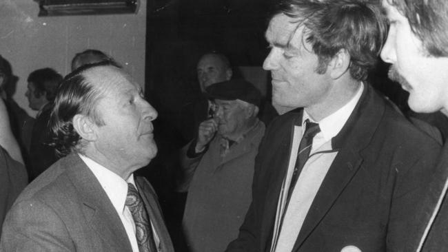 Sturt coach Jack Oatey is congratulated by Glenelg coach Neil Kerley and captain Peter Marker after the 1974 grand final.