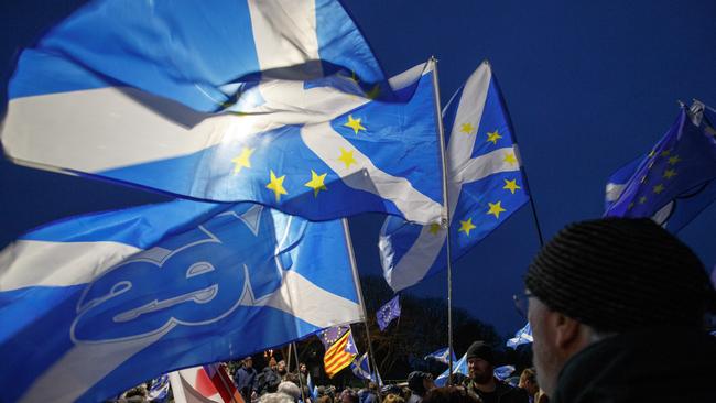 People hold up flags at the Missing EU Already Anti-Brexit Rally outside the Scottish Parliament at Holyrood Edinburgh. Picture: Getty