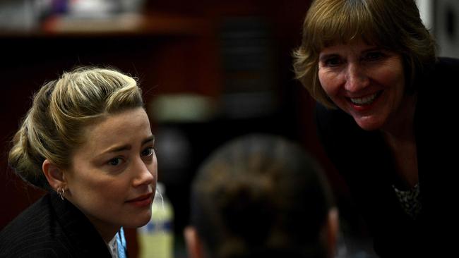 US actress Amber Heard, left, and attorney Elaine Bredehoft in the courtroom at the Fairfax County Circuit Courthouse in Fairfax, Virginia, on May 17. Picture: AFP