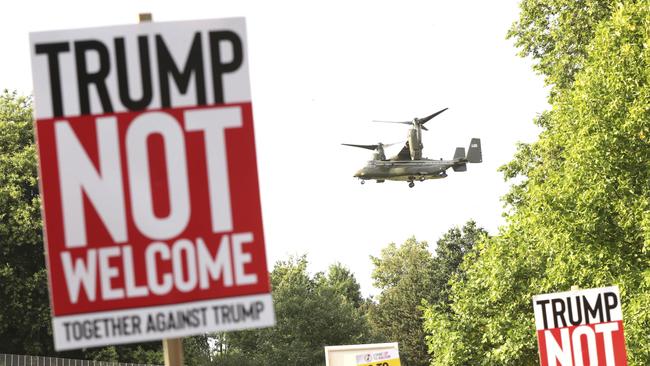 A helicopter leaves the grounds of the US ambassador’s residence in Regent's Park, London, as demonstrators protest. Photo: AP