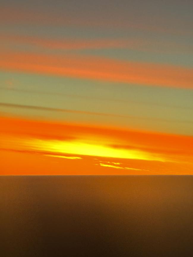 Sunrise on the first day of the year, flying into Victoria from an overnight flight from Antarctica. Picture: Melissa Costello, Brighton.