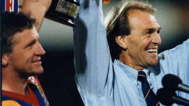 Footballer Chris McDermott (l) and coach Graham Cornes hold trophy on podium after victory. Football - SA vs Vic State of Origin match at Football Park 03 May 1994. (Pic by staff photographer Nicholas Wilson)