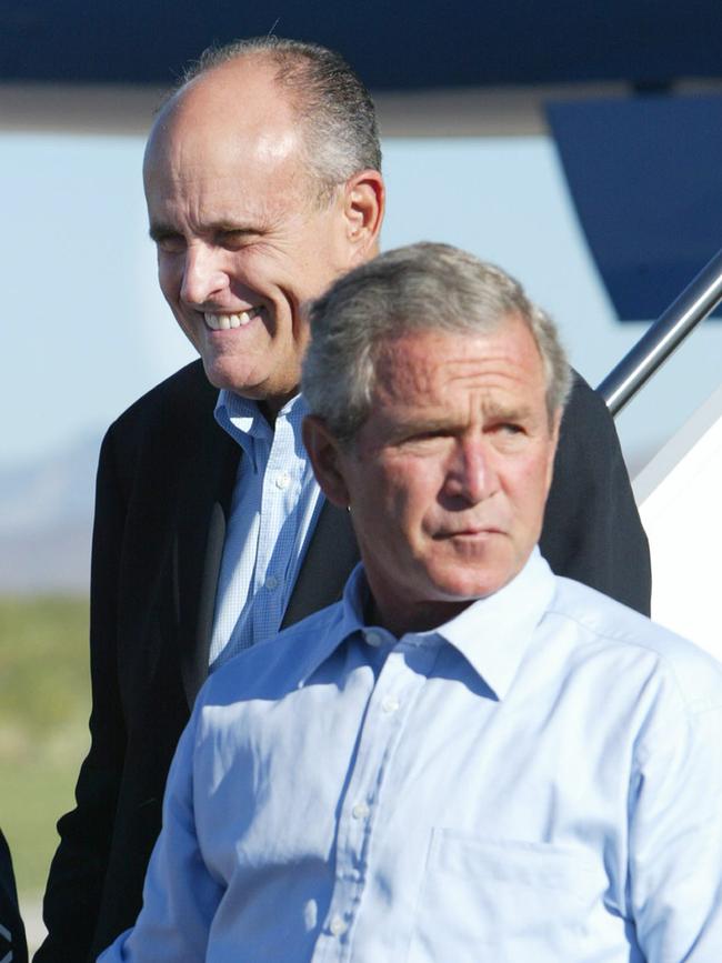 Giuliani with former US president George W Bush at Las Cruces International Airport on August 26, 2004.