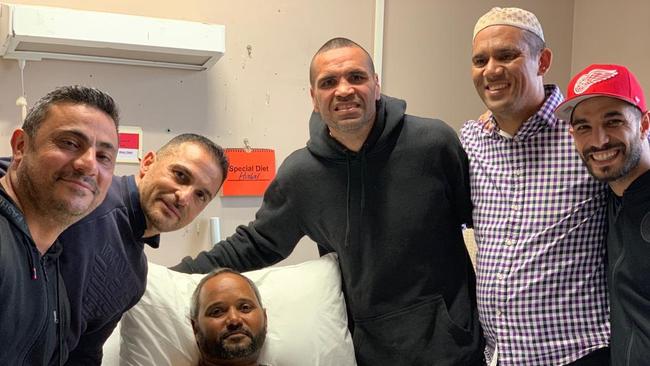 Anthony Mundine (centre), Billy Dib (far right) and Emaid Dib (second from left) with shooting survivor Zayeed Shah.