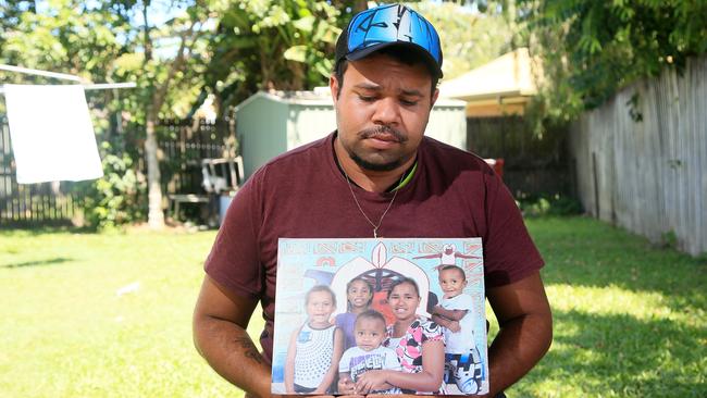 In 2016, a devastated 21-year old Lewis Warria and survivor of Murray St killings in Manoora, displays a portrait of 5 of the victims from the tragedy. Lewis was the first person to the discover the bodies of 7 younger brothers and sisters plus a niece on December 19, 2014, after they who were allegedly killed by mother Raina Thaiday. PICTURE: JUSTIN BRIERTY