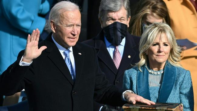 Joe Biden, flanked by incoming US First Lady Jill Biden, takes the oath of office as the 46th US President in January 2021. Picture: AFP