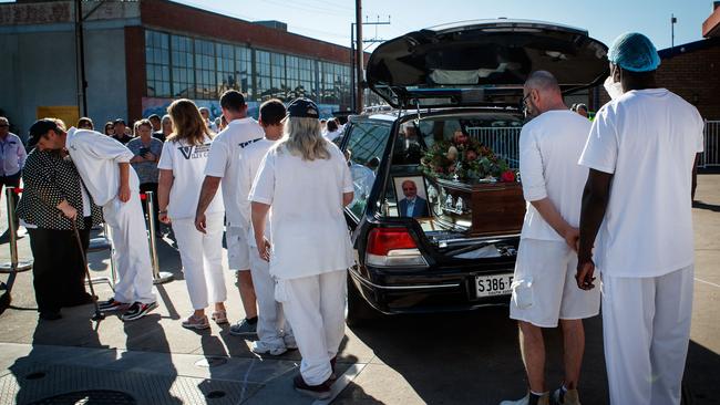 Bakery staff form a guard of honour in tribute to Mr Milisits, before his funeral later on Thursday. Picture: Matt Turner