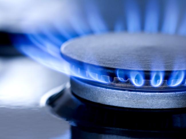 Blue flames from gas stove burner. Closeup shot of blue flames from a kitchen gas range.