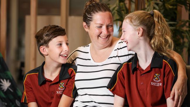 The Molloy family are happy they won’t be paying more this year in school fees at Xavier College, Two Wells. Pictured is mum Sarah with children Toby and Jasmine. Picture: Russell Millard