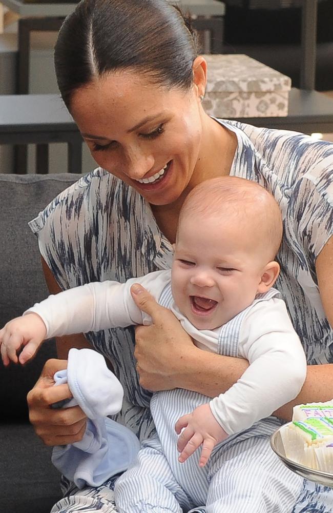 Archie giggled his way through a meeting with Archbishop Desmond Tutu. Picture: HENK KRUGER / POOL / AFP.