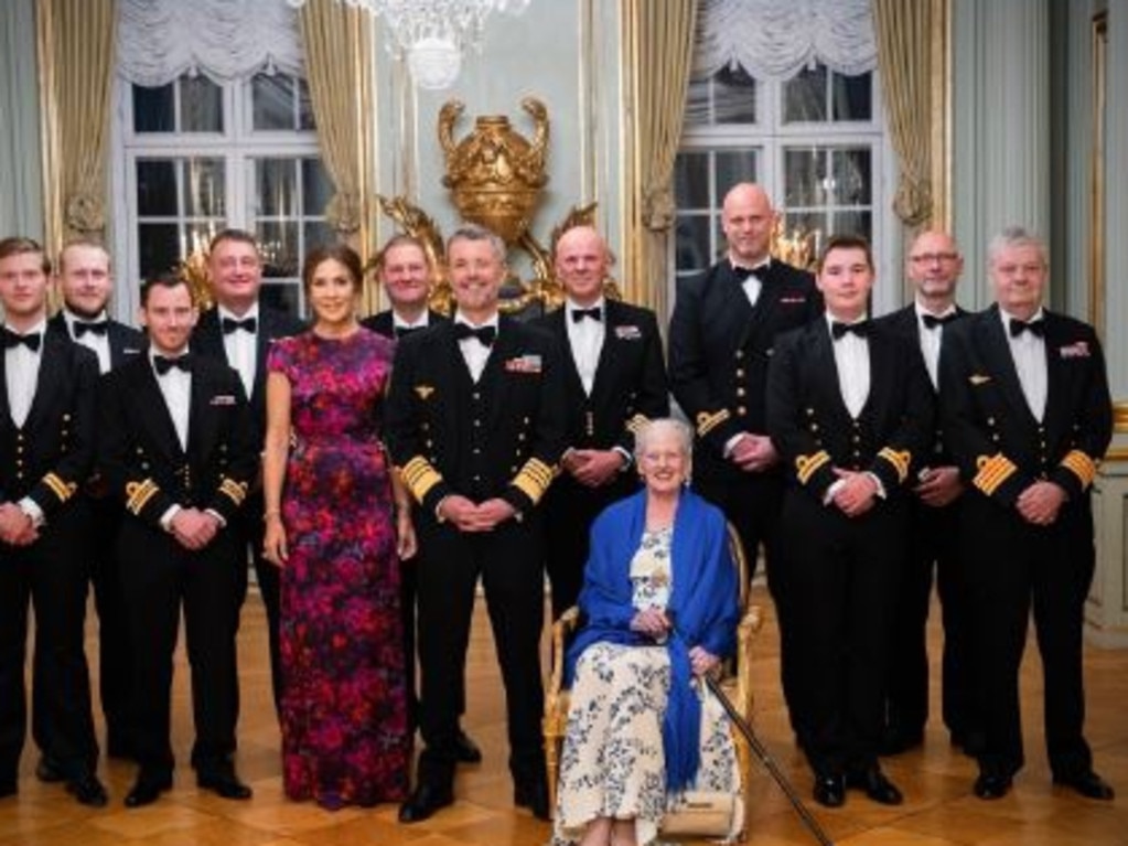 Queen Mary, King Frederik and Queen Margrethe with naval officers from the Dannebrog. Picture: Supplied