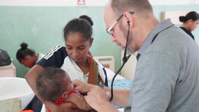 Adelaide doctors in East Timor accessing the locals seeking their help. Picture: Zameer Gill