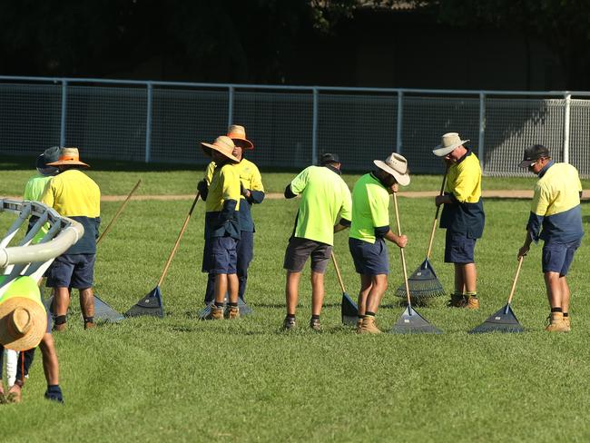 BCM News. Workers repairing the track at Eagle Farm racecourse. Western (Kitchener Rd) side of track looking North to South. Picture from Gordon St trainers entrance.