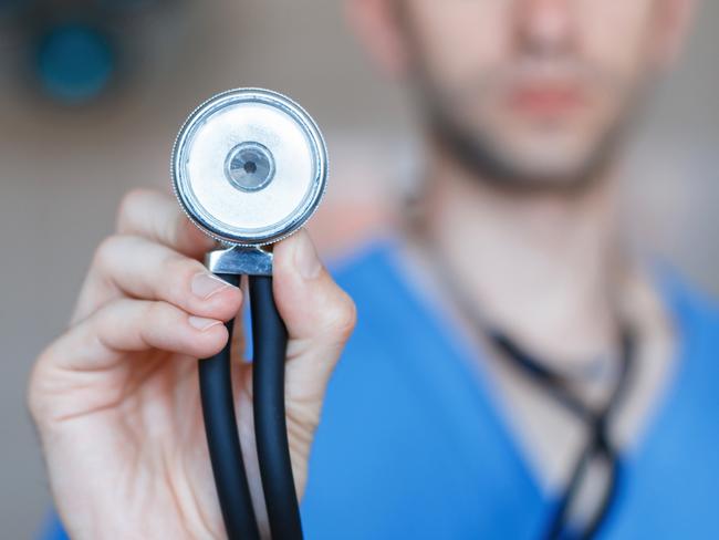 Doctor holding a Phonendoscope in his hand. Checks the health of the patient