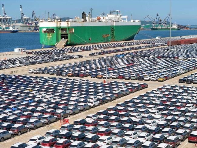 Cars wait to be loaded on to a ship at the port in Yantai, in China’s eastern Shandong province. Picture: AFP
