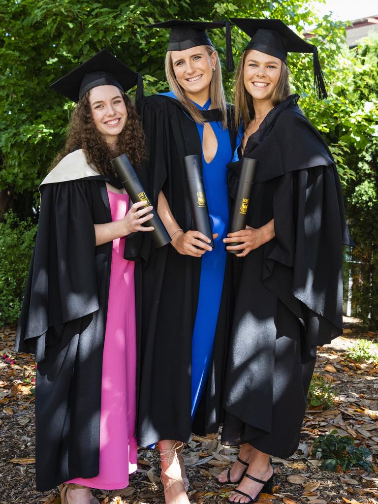 Good friends (from left) Lily Ryan (Bachelor of Communication and Media), Paris Pola (Bachelor of Nursing) and Bec Ryan (Bachelor of Nursing) celebrate graduating together at the UniSQ graduation ceremony at Empire Theatres, Wednesday, December 14, 2022.