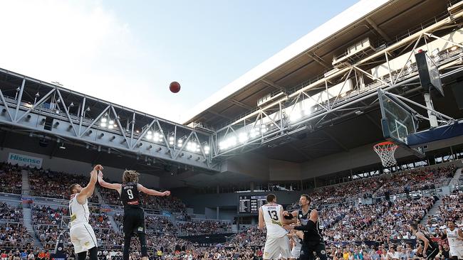 Adam Gibson takes a shot in front of big crowd at an open-air Hisense Arena. Picture: Getty Images