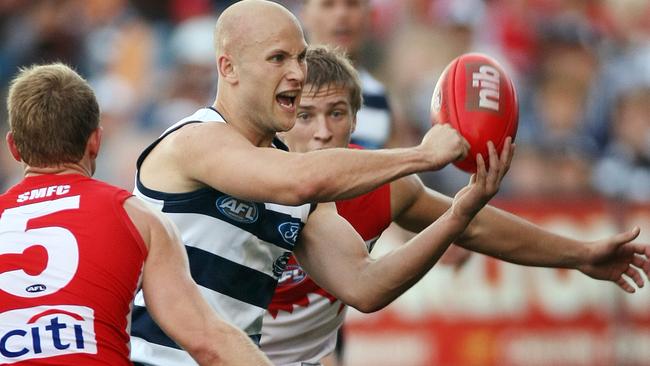 Kieren Jack (back) tries to stop Gary Ablett Jr.