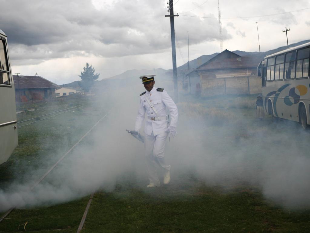 A Bolivian navy officer leaves the port of Guaqui after attending the inauguration of a new vessel at Lake Titicaca. Picture: Dado Galdieri/AFP