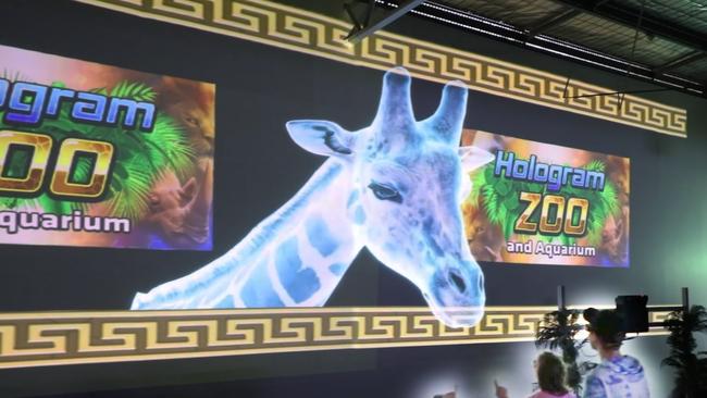 A lifelike holographic giraffe image.