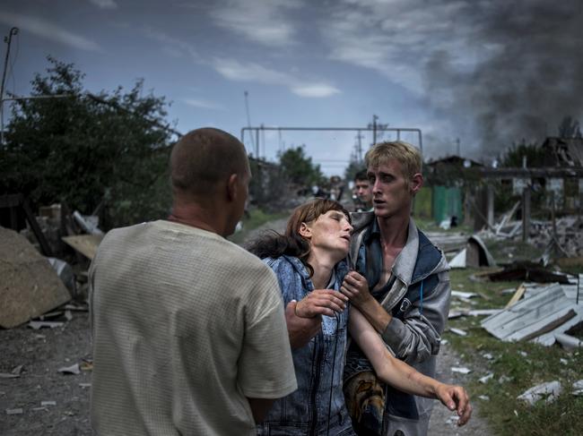 Long-Term Projects - First Prize © Valery Melnikov, Rossiya Segodnya Title: Black Days Of Ukraine Citizens in the village of Luhanskaya after the air attack. Story: Ordinary people became victims of the conflict between self-proclaimed republics and the official Ukrainian authorities from 2014 onwards in the region of Donbass. Disaster came into their lives unexpectedly. These people were involved in the military confrontation against their will. They experienced the most terrible things: the death of their friends and relatives, destroyed homes and the ruined lives of thousands of people