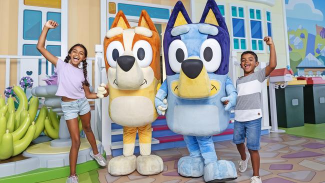 **UNDER EMBARGO UNTIL SUNDAY 13 OCTOBER** The first glimpse of Bluey's World Brisbane as fans eagerly await the opening next month. Pictured is Madeleine Evans, 10, and Joshua Evans, 7, with Bingo and Bluey.