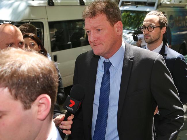 Toot toot Ricky Nixon leaves court during one of his many visits. Picture: Hamish Blair