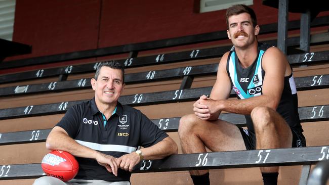 Scott Lycett (right), pictured with five-time Port Adelaide SANFL premiership player David Hutton, is set for his 10th season in the AFL. Picture: AAP/Kelly Barnes