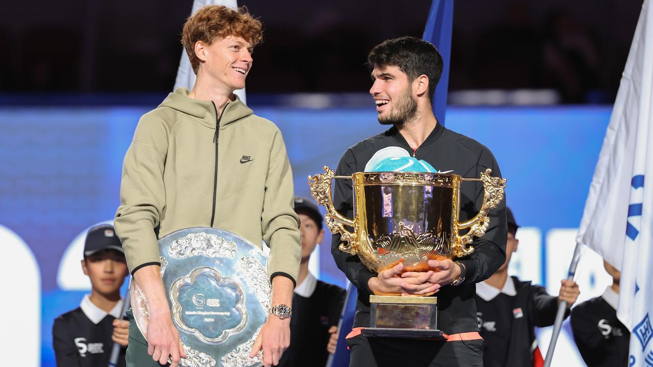 BEIJING, CHINA - OCTOBER 02: Carlos Alcaraz of Spain and Jannik Sinner of Italy poses with the winners trophy after the Men's Singles Finals match on Day 10 of the China Open at National Tennis Center on October 02, 2024 in Beijing, China. (Photo by Lintao Zhang/Getty Images)