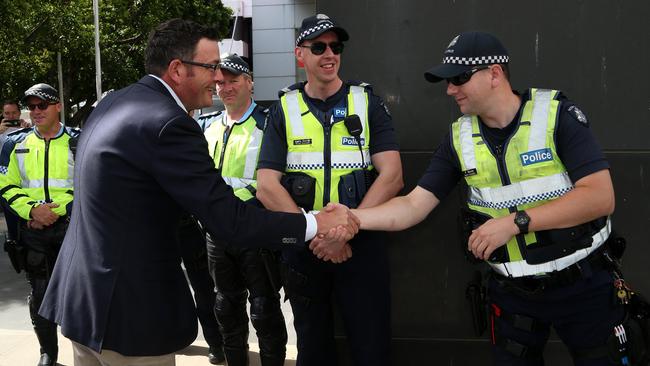 Premier Daniel Andrews meets police at the announcement. Picture: Hamish Blair