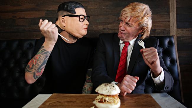 Josh Franco dressed up as Kim Jong-un and journalist Jon Geddes dressed up as Donald Trump as Originals Burger Co. in Brookvale promoted a new burger. Picture: Adam Yip / Manly Daily