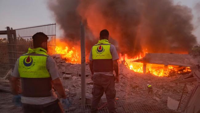 Rescuers rush to the scene of an Israeli airstrike that targeted the southern Lebanese village of Abbasiyeh. Picture: AFP