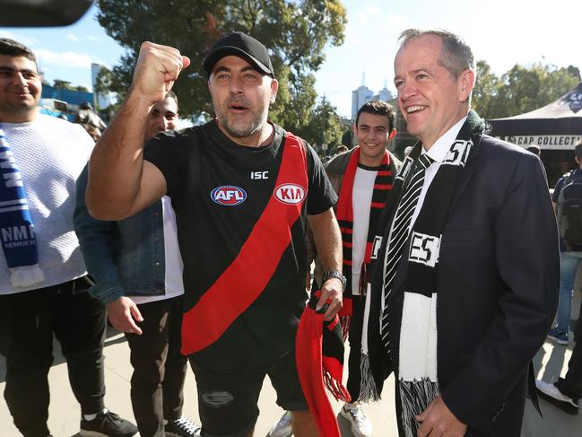 Opposition Leader Bill Shorten meets Bombers fans as he arrives at the MCG for the AFL Anzac Day game between Collingwood and Essendon. Picture: Kym Smith