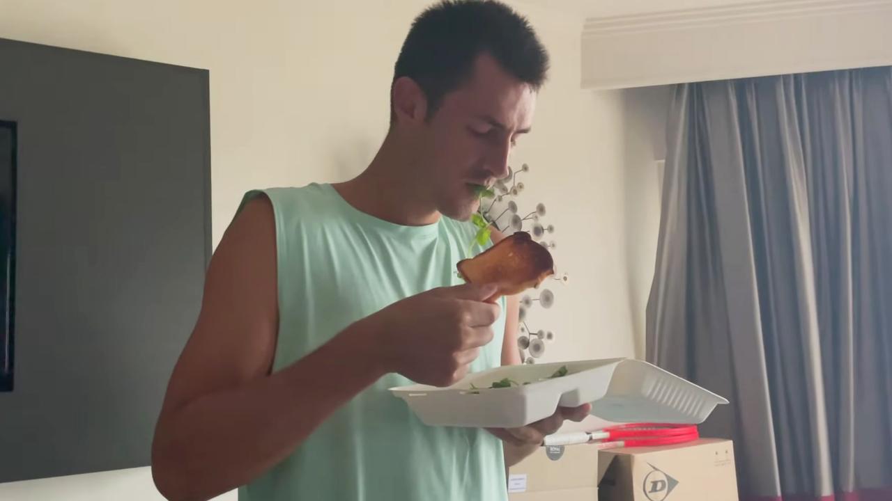 Bernard Tomic looking very unenthused about his toast.