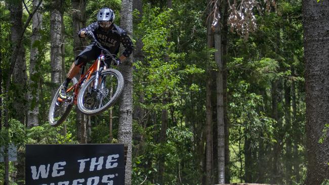 Cairns mountain bike rider Tyson Jones clears the final ramp of the Numinbah Valley Gravity Park track on the Gold Coast in spectacular fashion. Photo: John McJannett @johnomcj